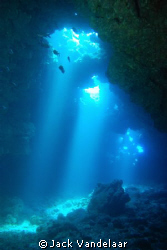 Cavern off Maui-  natural light coming from the top, make... by Jack Vandelaar 